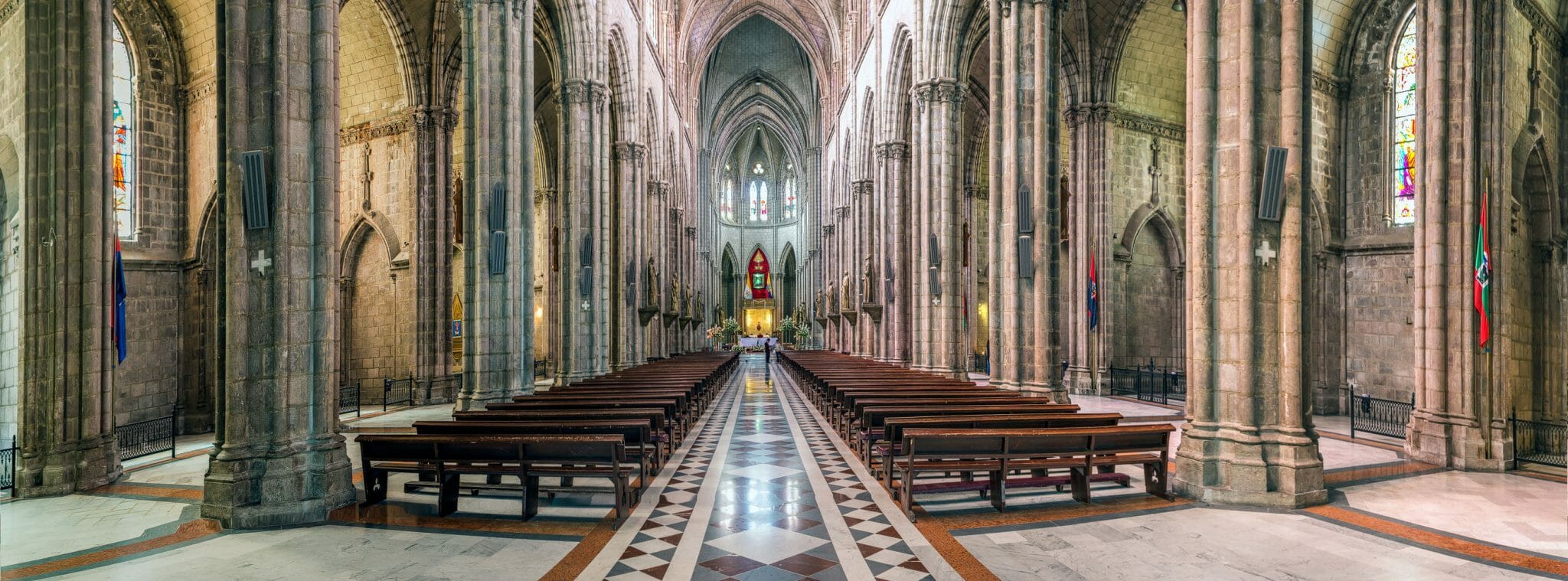 Panoramic view of central nave of the Basilica del Voto Nacional in Quito