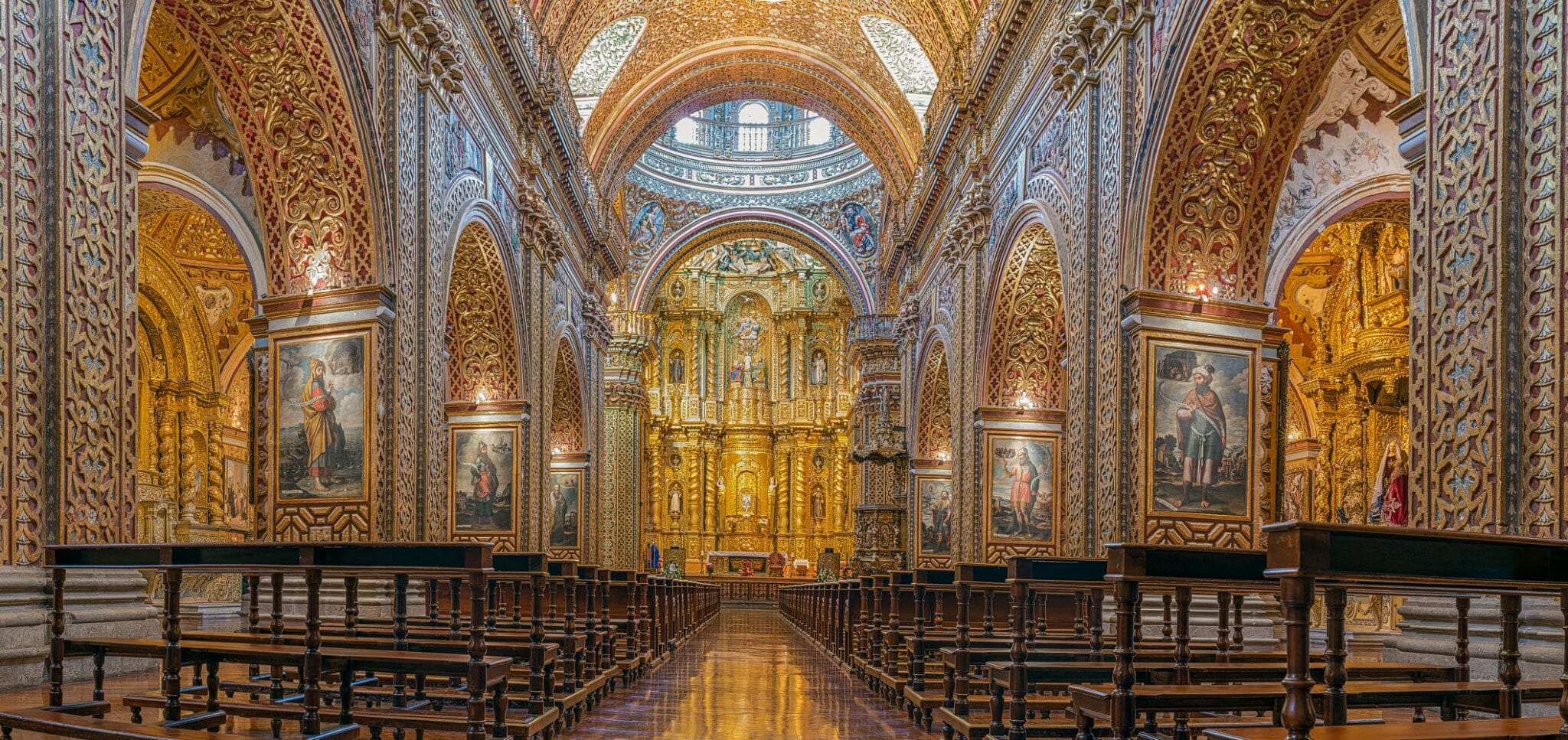 Panoramic view of the central nave La Compania Jesuit church in Quito